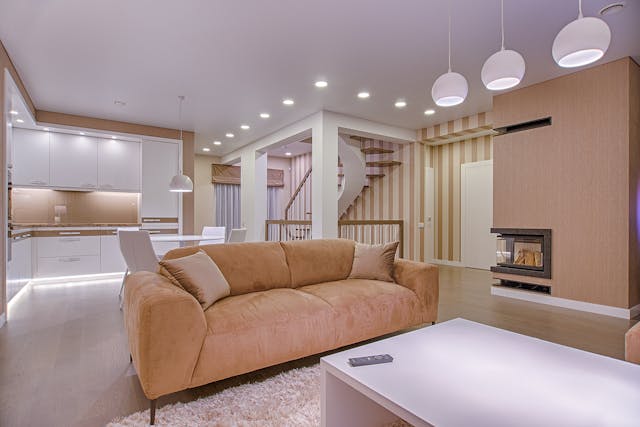 a contemporary living room with a couch coffee table and a television