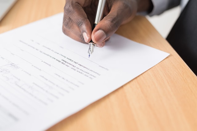 close-up-of-a-hand-signing-a-document-with-a-fountain-pen