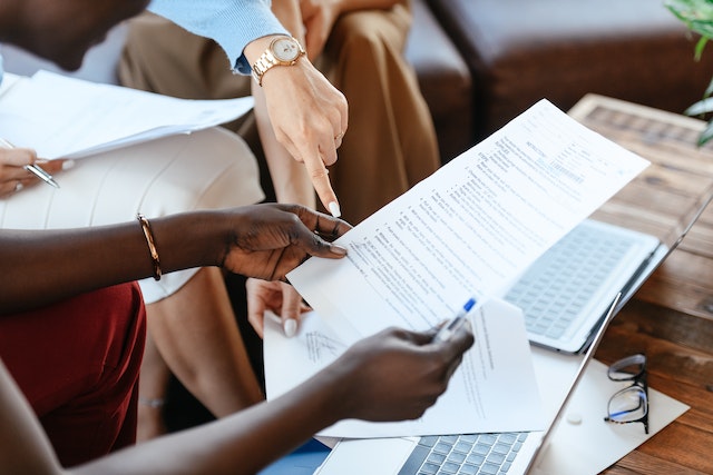 business professionals looking over documents